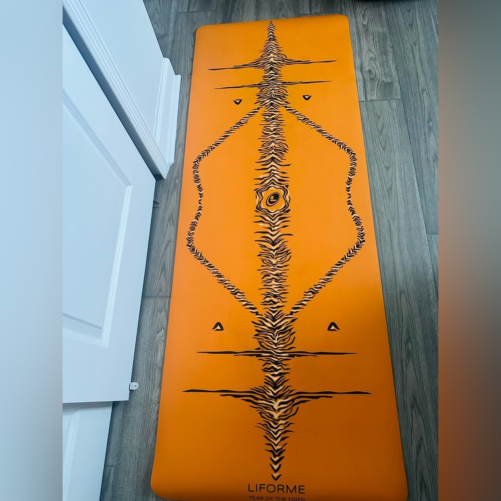 Orange and Black Liforme yoga mat